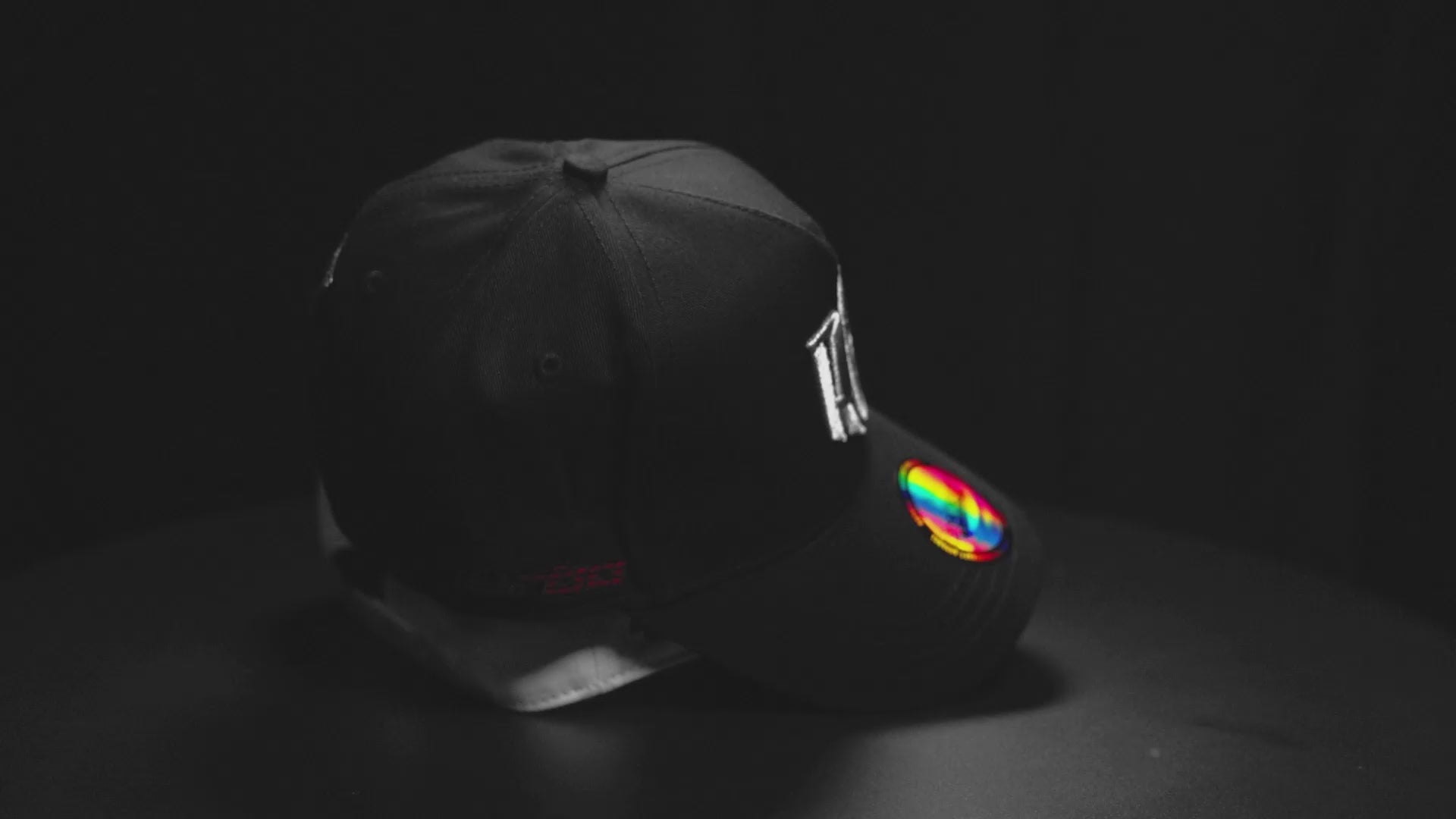 rotating display of black and white rc racecraft snapback a-frame holden commodore vl turbo caps