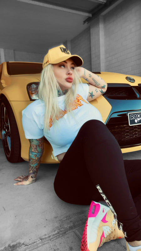 female model sat in front of HSV wearing rc racecraft GTSR snapback a-frame cap
