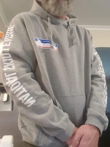 Person wearing a gray hoodie with text and a logo on the chest.
