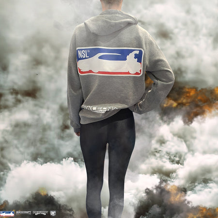 Person wearing a hoodie with a logo in a smoky environment