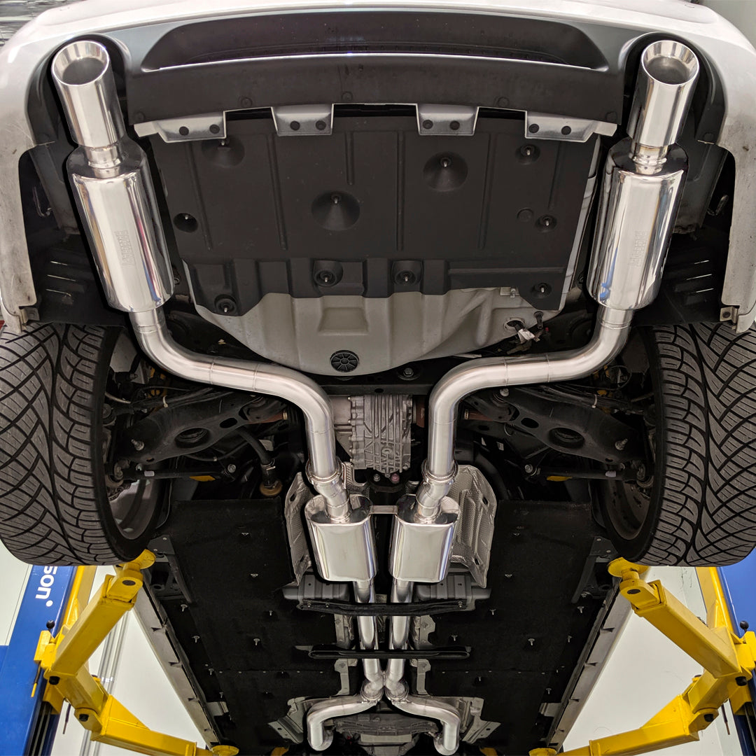 racecraft round stainless mufflers on chrysler 300c with custom exhaust underneath vehicle view
